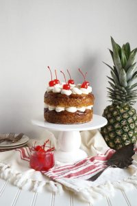 pineapple upside down cake on cake stand