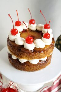 angled view of pineapple upside down layer cake