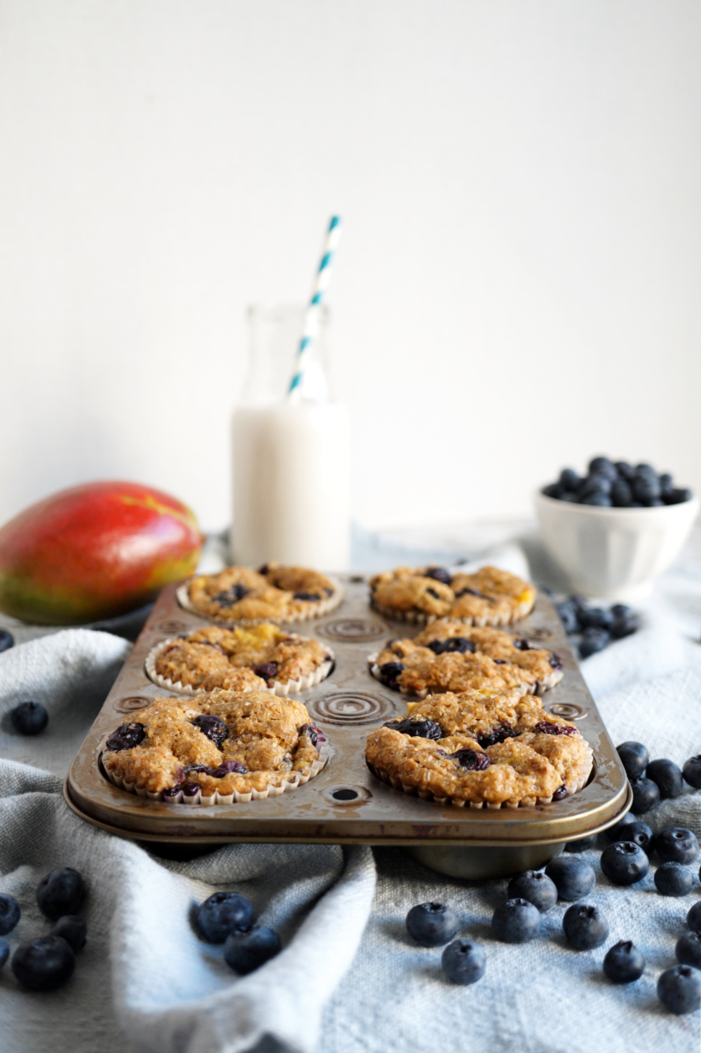 blueberry mango muffins in tin