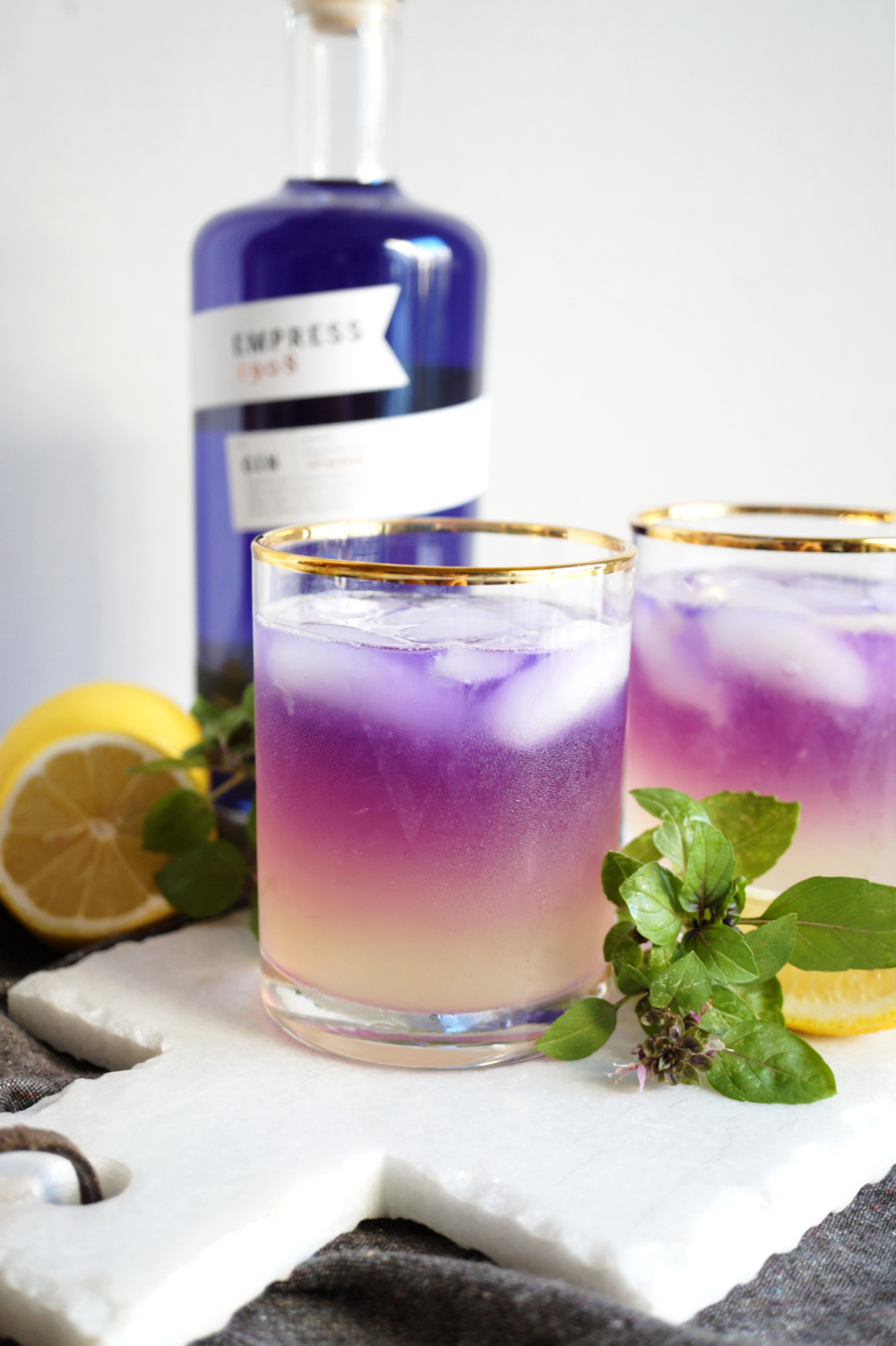 close up of one glass of purple basil gin fizz