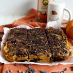 head-on shot of pumpkin swirl brownies on parchment