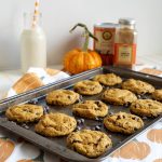 pumpkin chocolate chip cookies on cookie sheet