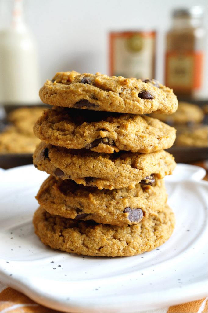 close up of a stack of pumpkin chocolate chip cookies