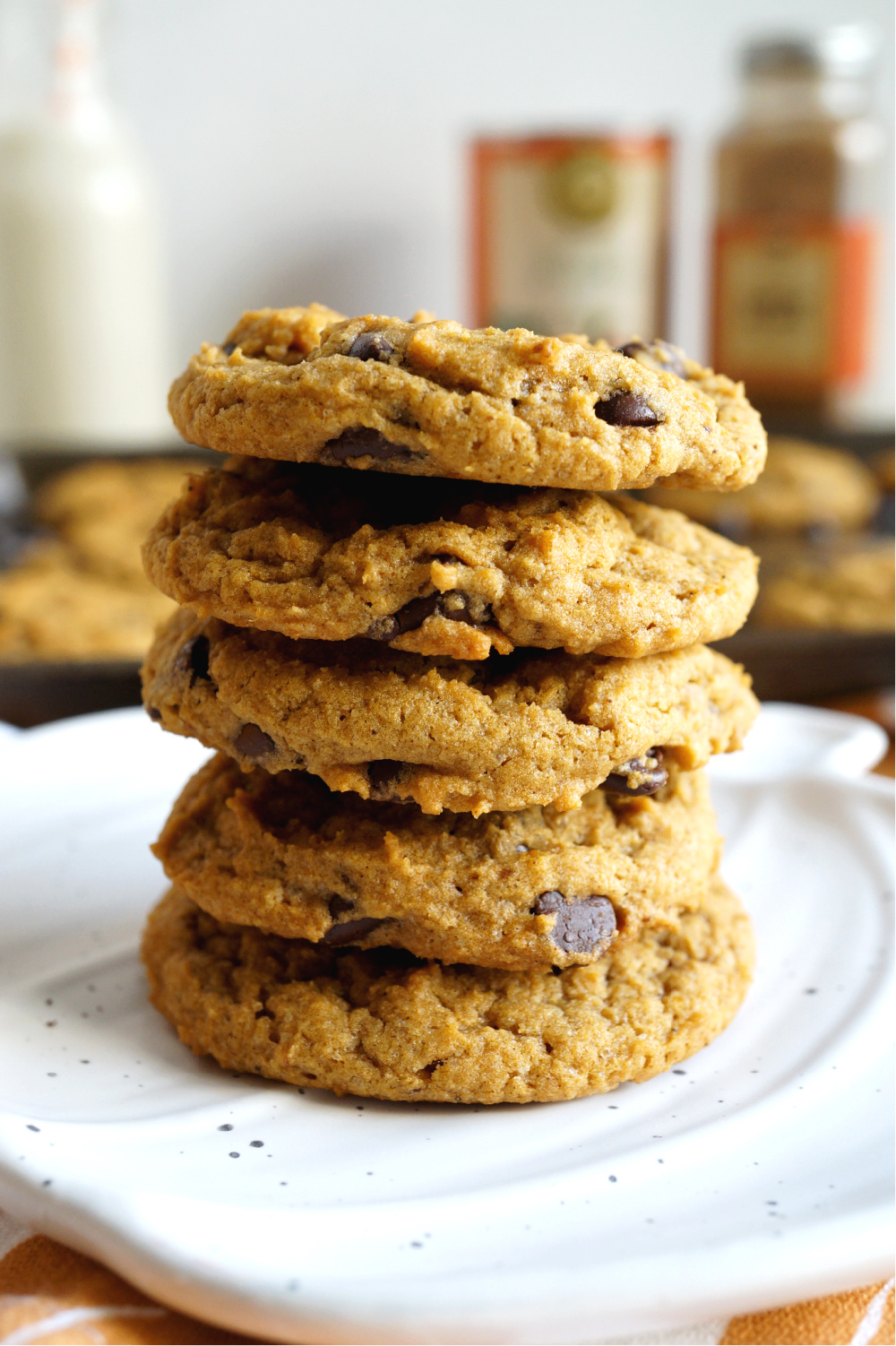 close up of a stack of pumpkin chocolate chip cookies