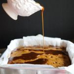 pouring caramel over apple cake