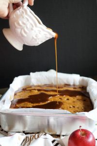 pouring caramel over apple cake