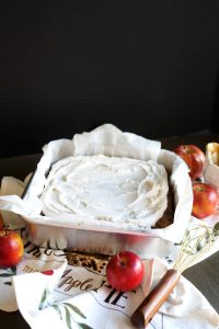 caramel apple cake with whipped cream on top