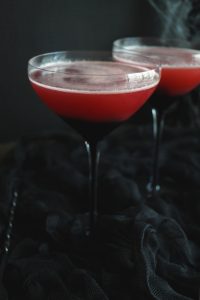 two glasses of red cherry vampire's kiss cocktail