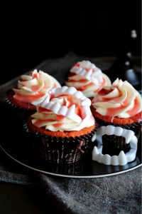 cherry cupcakes with cherry juice and vampire teeth
