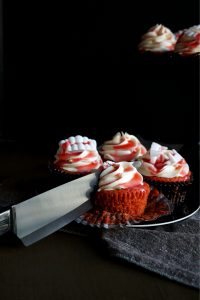 cherry cupcake with knife