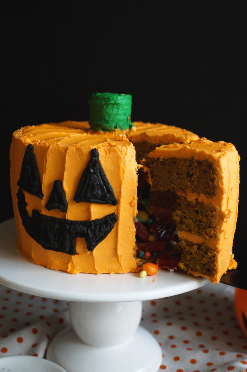 slice cut of cake with candy pouring out