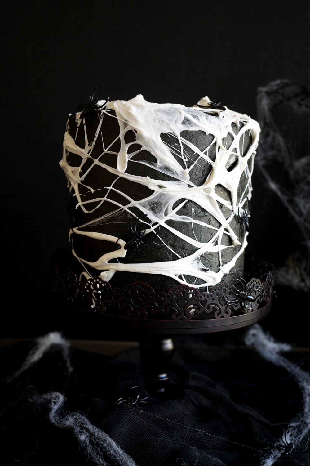 marshmallow spiderweb cake on cake stand