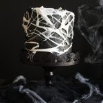 marshmallow spiderweb cake on cake stand