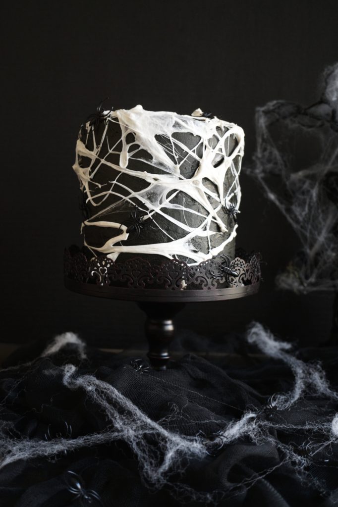 marshmallow spiderweb cake on cake stand