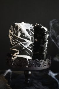 spiderweb cake with slice cut
