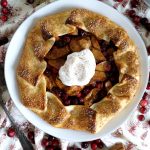 overhead shot of apple galette with whipped cream