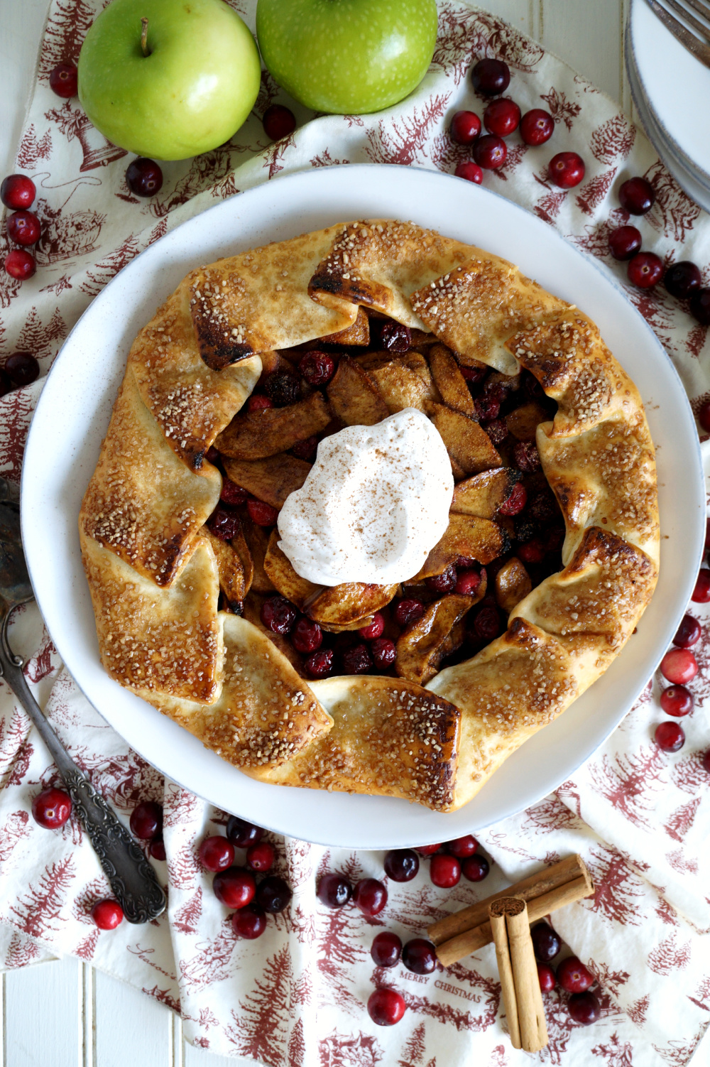 overhead shot of apple galette with whipped cream