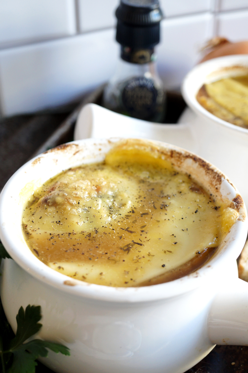 close up of melted cheese on soup