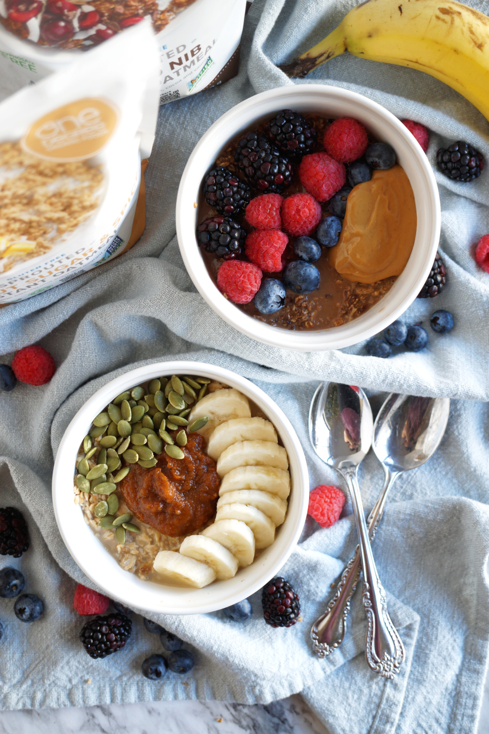 overhead shot of two decorated bowls of oatmeal