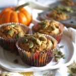 muffins on a plate with pumpkin seeds