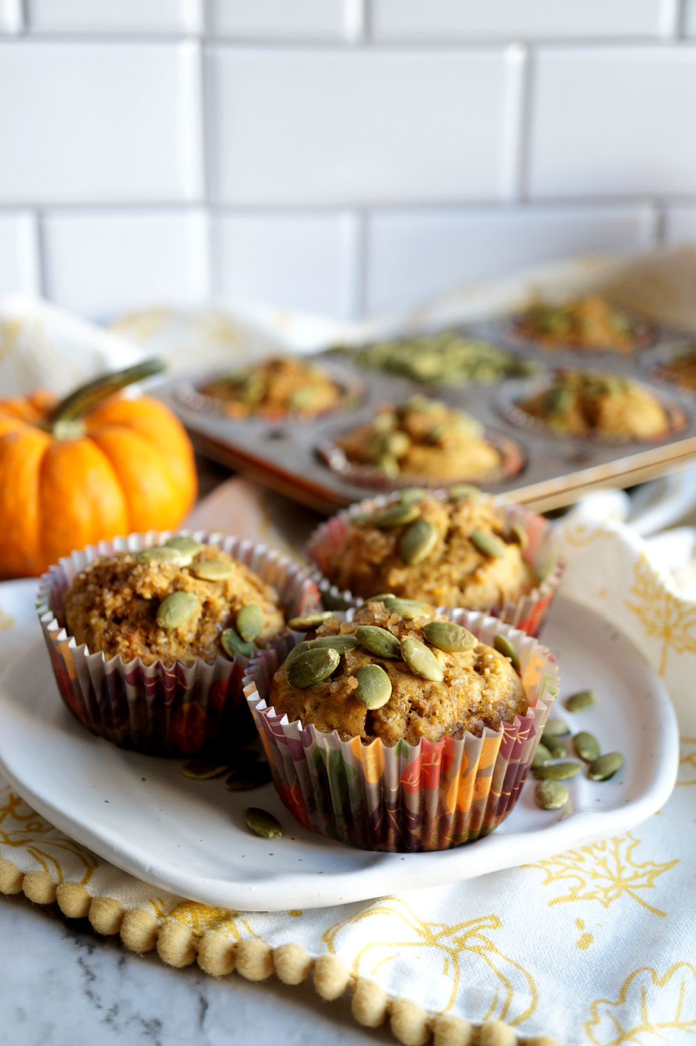 trio of pumpkin banana muffins on a plate