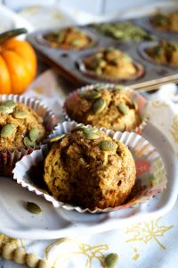 pumpkin banana muffin with bite on plate