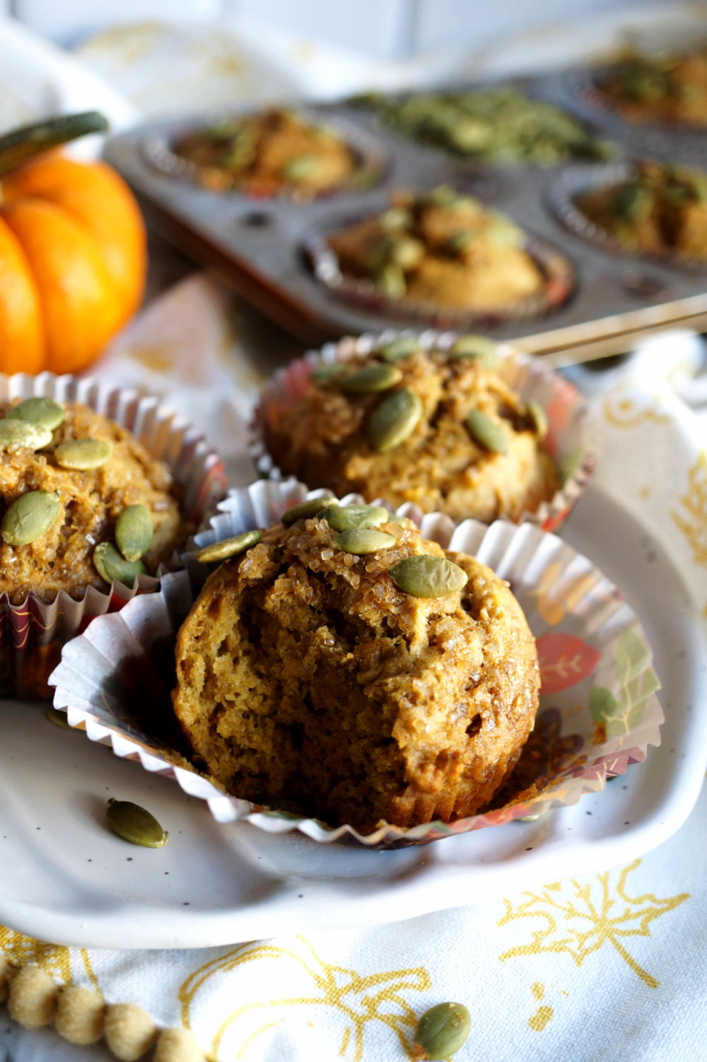 pumpkin banana muffin with bite on plate