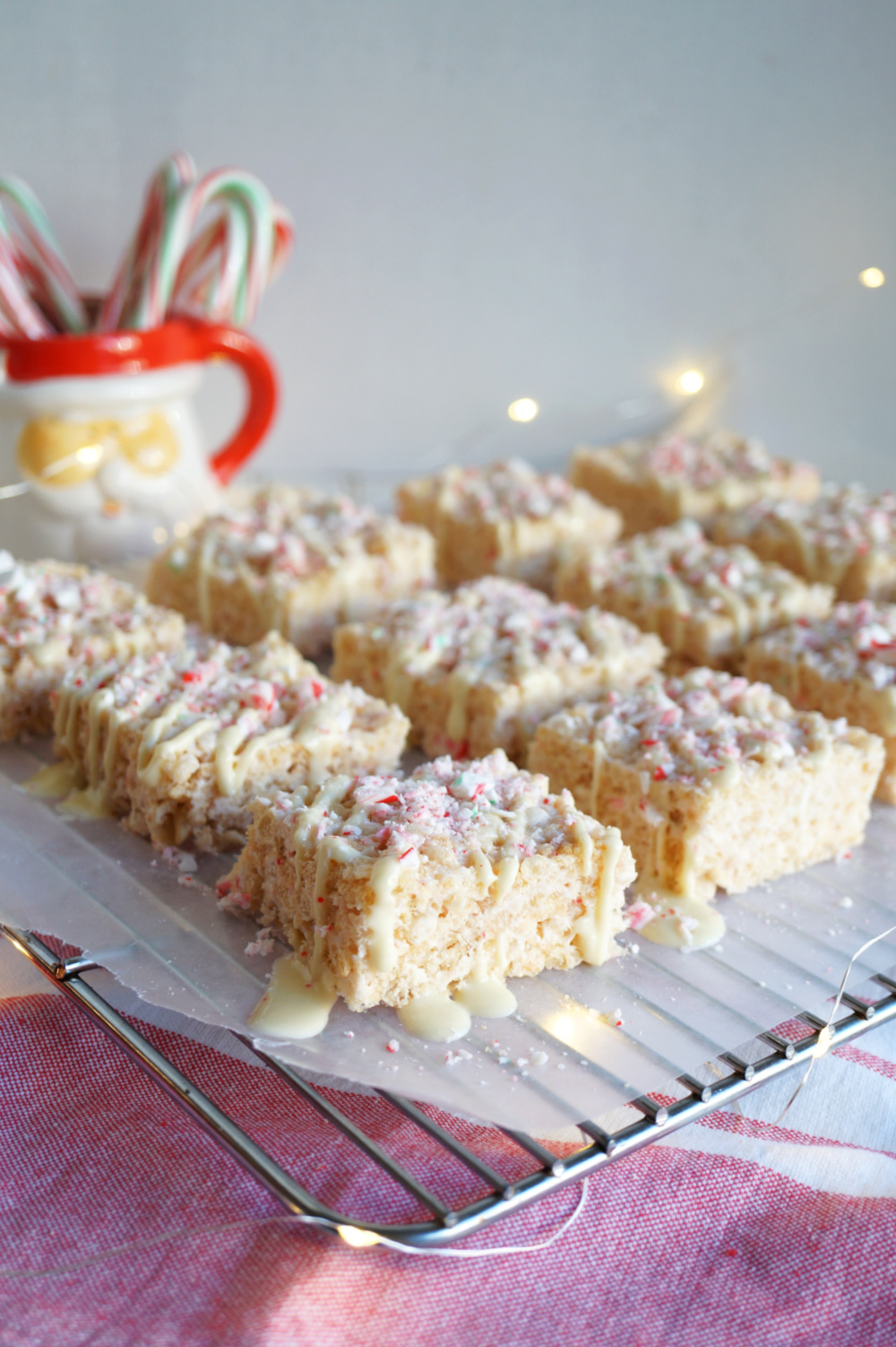 rice Krispie treats on cooling rack with lights