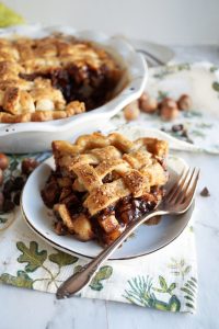 slice of chocolate hazelnut pear pie on a plate