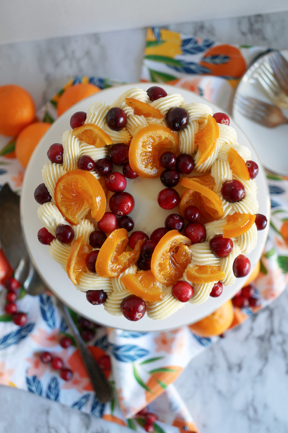 overhead shot of frosted cranberry clementine cake 