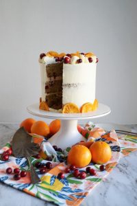 cranberry clementine cake with slice cut out