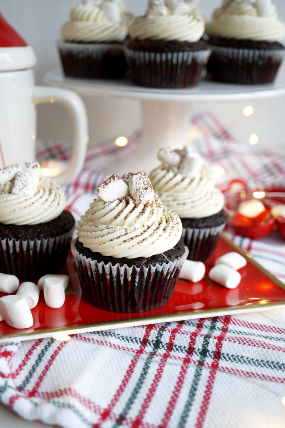 chocolate cupcakes with marshmallows on red tray