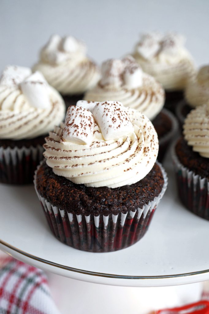 hot cocoa cupcakes on cake stand