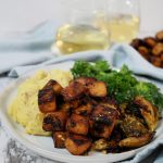 balsamic herb tofu on a plate with mashed potatoes and kale salad