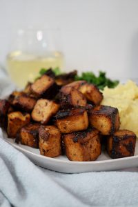 close up of baked balsamic tofu cubes