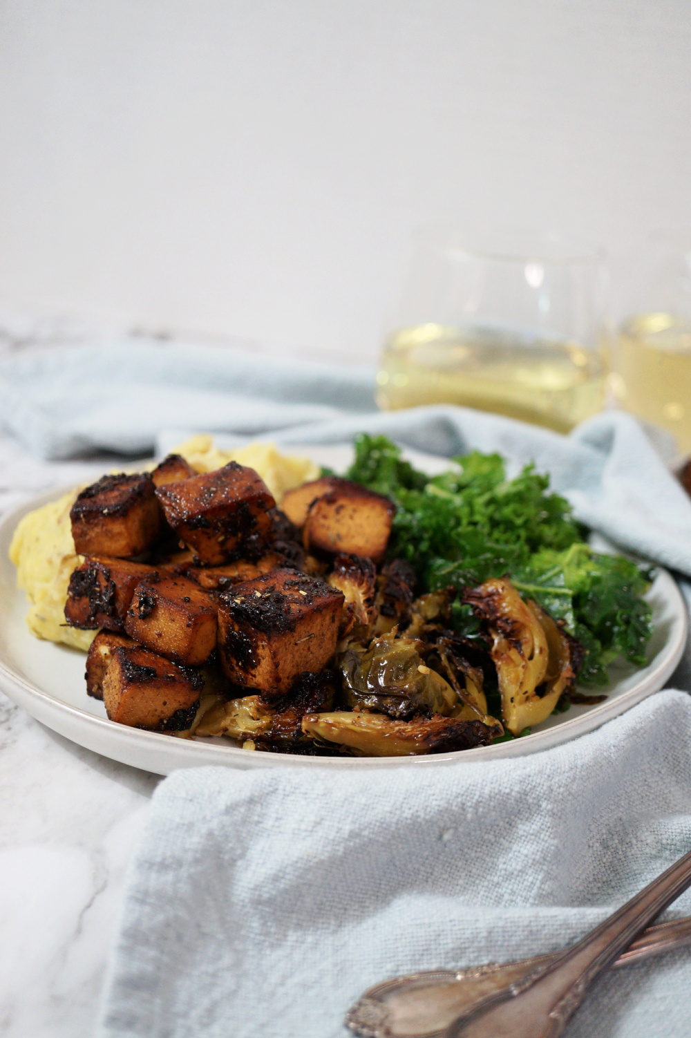 plate of baked tofu with roasted Brussels sprouts