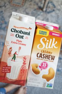 cartons of oat milk and cashew milk