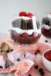 glass of raspberry and chocolate cake parfait