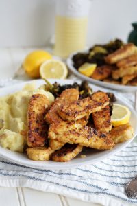 plate of lemon pepper tempeh with mashed potatoes