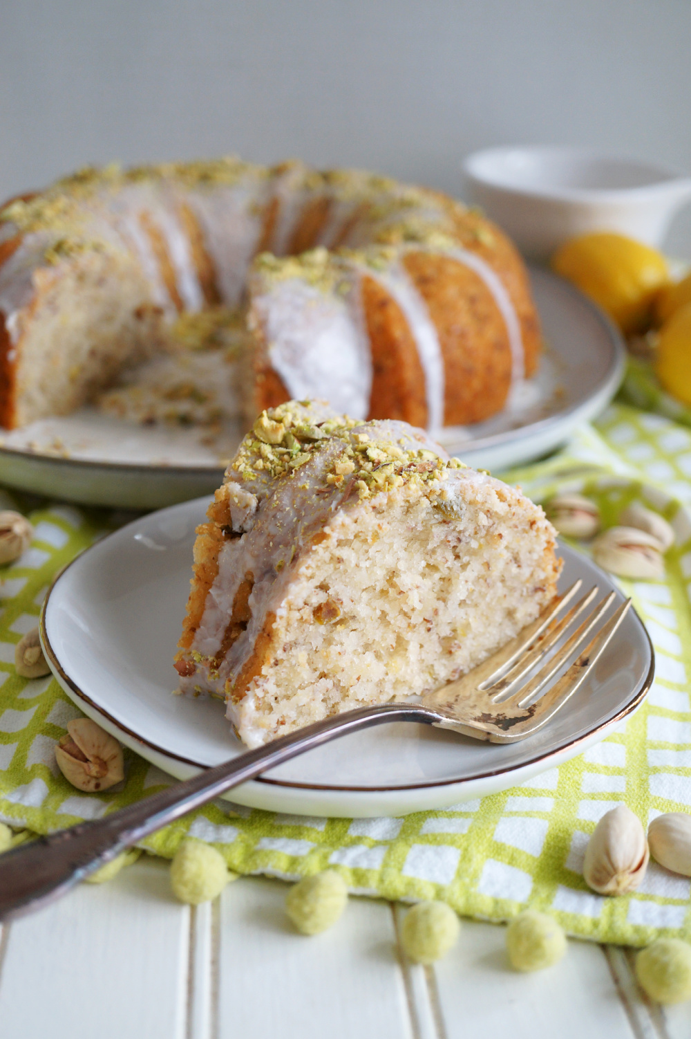 slice of lemon pistachio bundt on plate