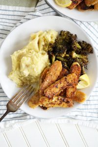 plate of lemon pepper tempeh with side dishes