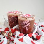 two clear mugs of red velvet cocoa