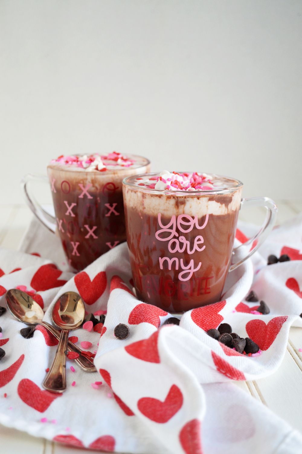 two clear mugs of red velvet cocoa
