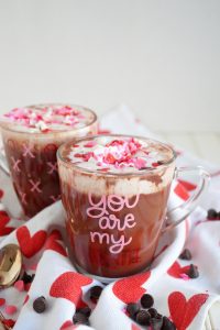 two mugs of red velvet hot cocoa