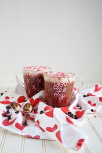two glass mugs with hot cocoa