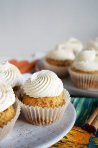 carrot cake cupcakes with swirled white frosting