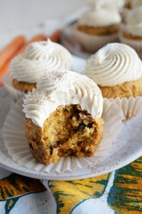 carrot cake cupcake with a bite taken out