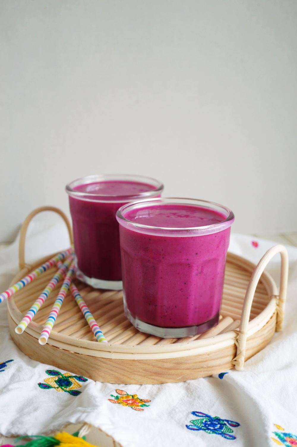 two cups of pink pitaya smoothie