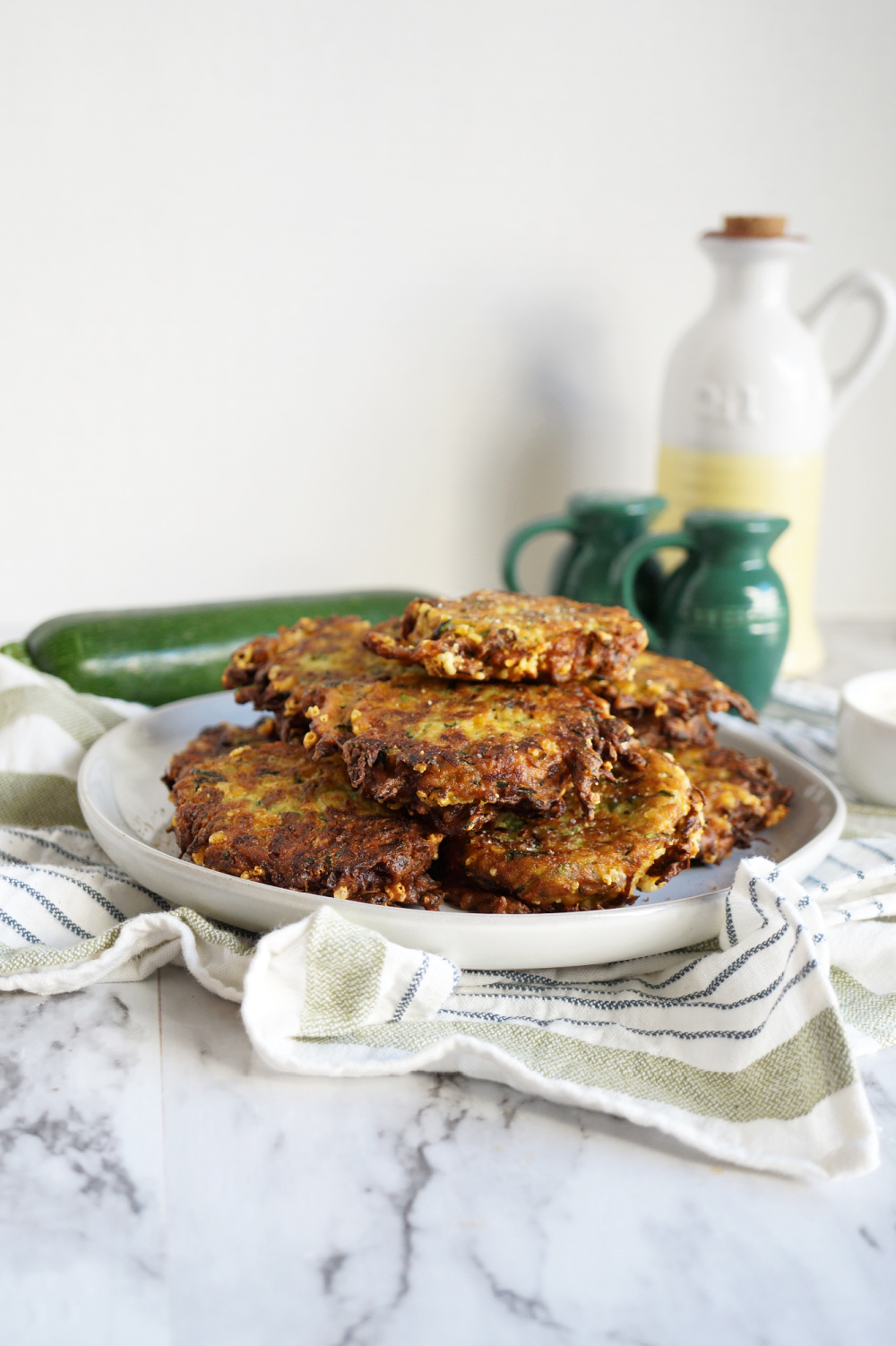 stack of zucchini fritters on plate