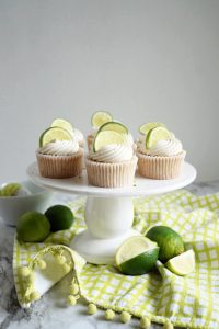 key lime cupcakes on cake stand